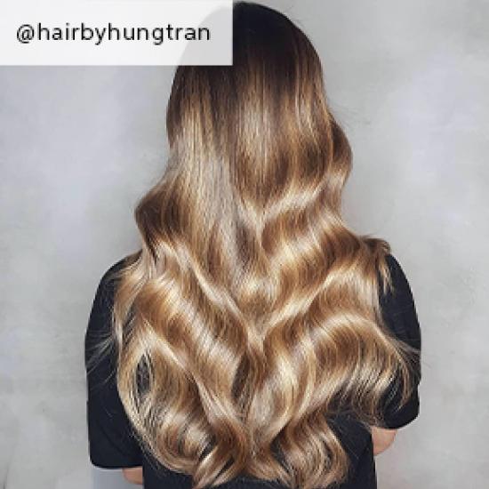 Wavy toffee blonde hair, created using Wella Professionals