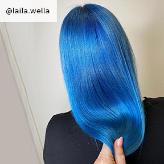 The back of a woman's blue tone, straight hair.