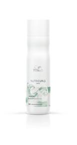 A green and white cylidrical bottle of NUTRICURLS micellar shampoo for curly hair