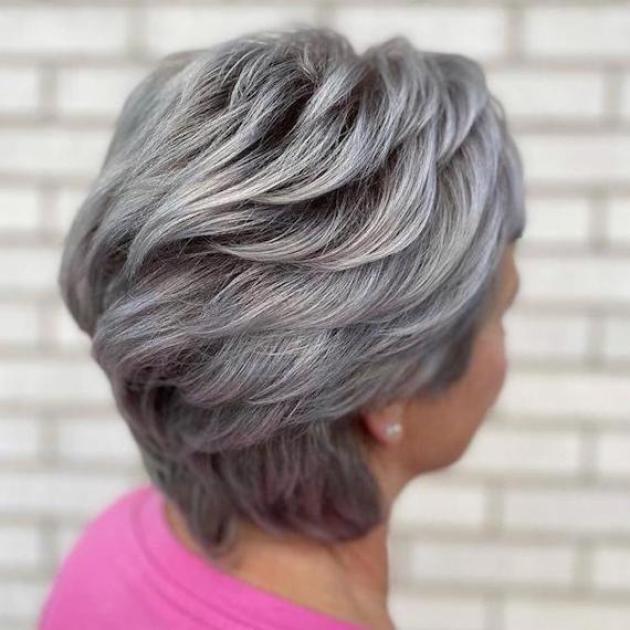 Back of woman’s head with short, gray, blow-dried hair, created using Wella Professionals.