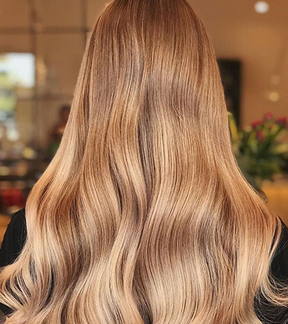 Image of warm butterscotch blonde hair, created using Wella Professionals