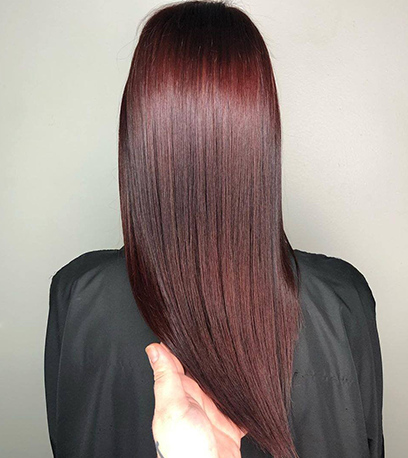 Glossy cherry cola hair color, created using Wella Professionals products