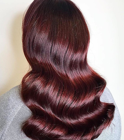 Dark cherry hair, created using Wella Professionals.