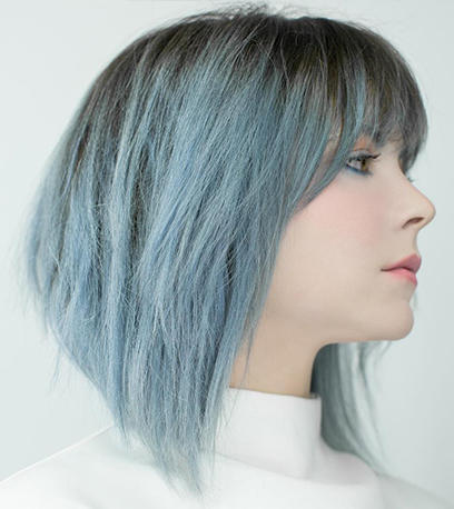 Woman with shoulder-length straight denim blue hair