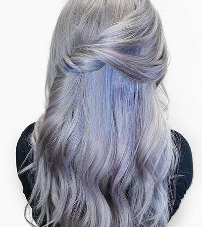 Woman with long wavy denim blue hair created using Color Touch