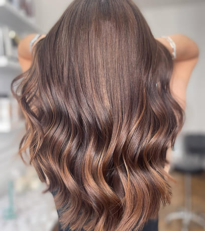 Hair treated with Brunette Signature Naturals Collection with a focus on Shinefinity Glaze